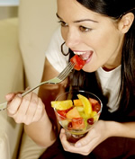 Woman Eating Fruit